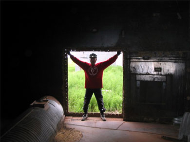 Steve at the door of an empty grain silo