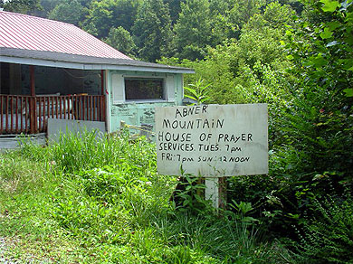 A sign for a small prayer service