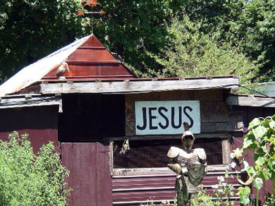 Everyone should have a “Jesus” sign and a suit of armor in their front yard