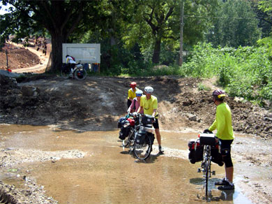 Steve, John, Anne, Fran, and Ora Sue taking a detour around a half-built bridge