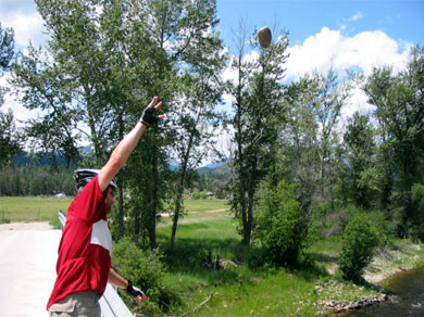 Steve throwing rocks into the river