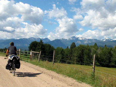 Mickey riding on the narrow, mountainous, winding, gravel roadway