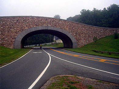 Steve riding under a bridge