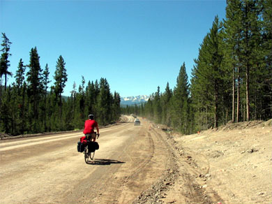Steve riding out of Yellowstone on a dirt road